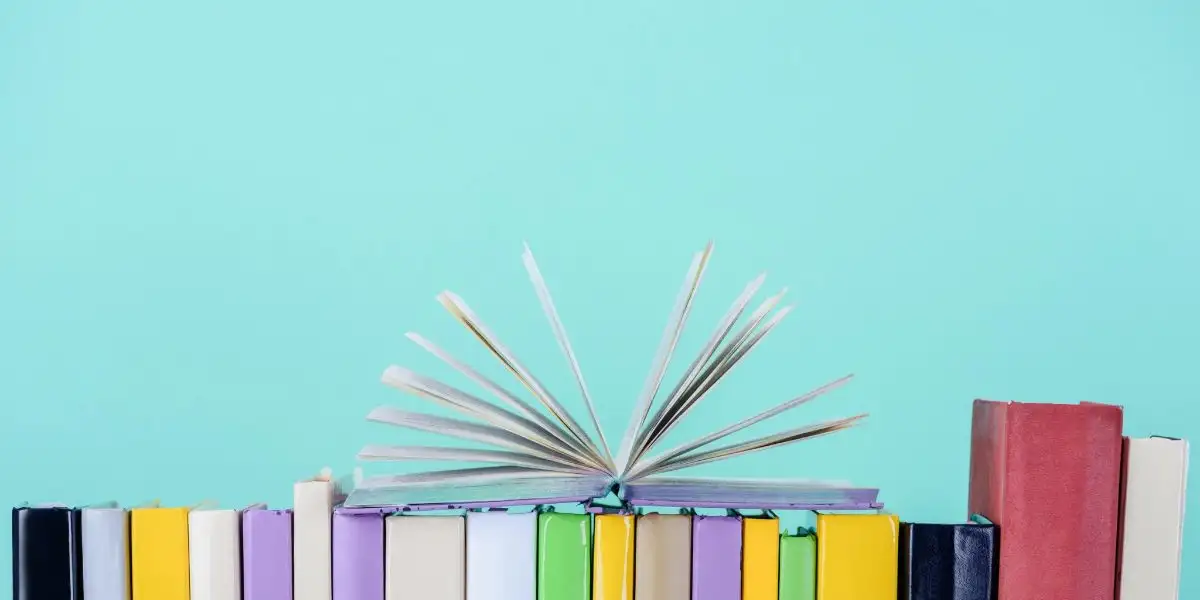 A decorative image with some books ro represent Books And Reading.